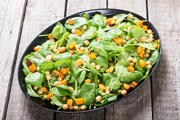autumn salad with pumpkin , spinach , chickpea and sesame