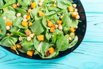 autumn salad with pumpkin , spinach , chickpea and sesame