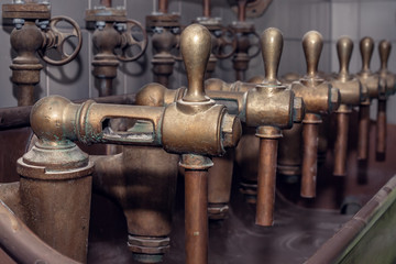 old taproom at the brewery, beer taps