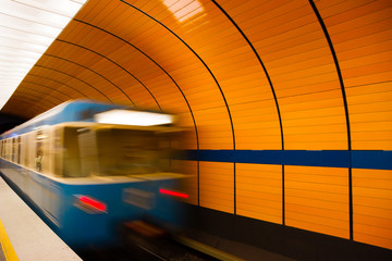 Underground train leaving platform in Munich, Germany
