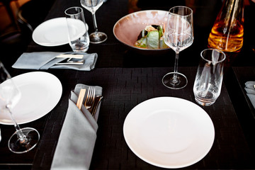 Empty glasses on the table and light table setting 