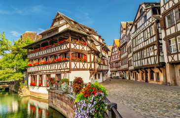 Little France (La Petite France), a historic quarter of the city of Strasbourg in eastern France. Charming half-timbered houses. Famous Maison de Tanneurs house. - obrazy, fototapety, plakaty