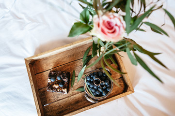 Breakfast served in bed with flower. Soft focus