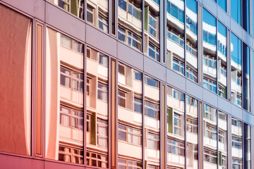 glass facade of modern office building , window reflection