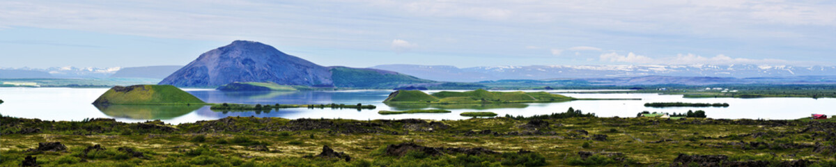 Fototapeta na wymiar Panorama of Myvatn lake with islets of volcanic pseudocraters in Northern Iceland.