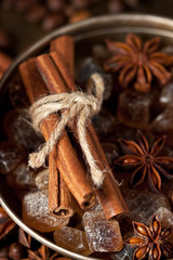 Cinnamon sticks and star anise on brown sugar