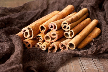 Cinnamon sticks on wooden table,  food ingredient