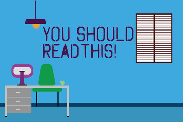 Fototapeta premium Text sign showing You Should Read This. Conceptual photo Recommendation be informed get more knowledge Work Space Minimalist Interior Computer and Study Area Inside a Room photo