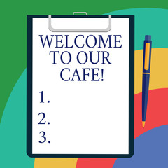Conceptual hand writing showing Welcome To Our Cafe. Business photo showcasing Greeting receiving showing in restaurant good attention Sheet of Bond Paper on Clipboard with Ballpoint Text Space