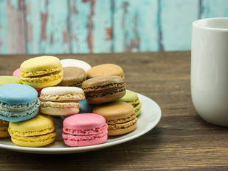French macarons with a coffee cup