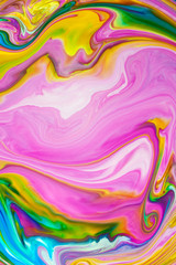 Abstract yellow multicolored background pink green yellow view macro paint acrylic underwater ultra drop blob drip plastic coral