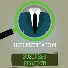Conceptual hand writing showing Implementation Business Project. Business photo text process of executing a plan or project Magnifying Glass Enlarging a Tuxedo and Label Tag Below