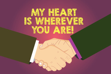 Word writing text My Heart Is Wherever You Are. Business concept for Expressing roanalysistic feelings and emotions Hu analysis Shaking Hands on Agreement Greeting Gesture Sign of Respect photo