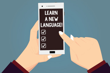 Word writing text Learn A New Language. Business concept for Study Words other than the Native Mother Tongue Hu analysis Hands Holding Pointing Touching Smartphone Blank Color Screen