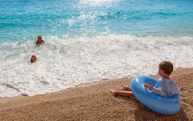 Family on summer Ionian sea
