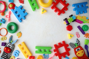 Children's toys and accessories on a white background. View from above