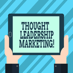 Text sign showing Thought Leadership Marketing. Conceptual photo art of positioning your company as a leader Hu analysis Hand Holding Blank Screen Tablet Smartphone Display Unit photo