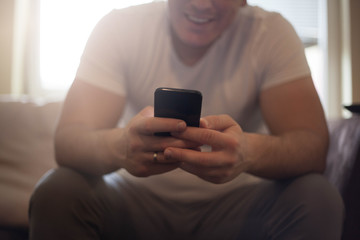 Man typing on phone.