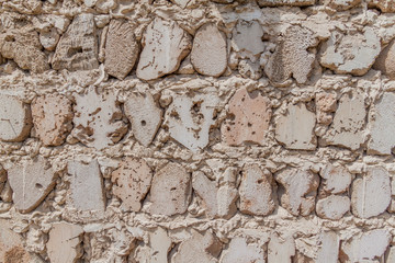 Detail of an old fortification wall made of colar stone at the Heritage Area in Sharjah, UAE