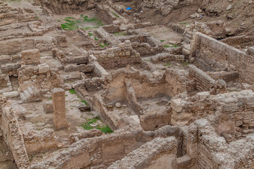 Ruins of ancient settlements near Bahrain Fort (Qal'at al-Bahrain) in Bahrain - obrazy, fototapety, plakaty
