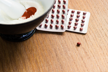 Herbs powder in the mortar and pestle
