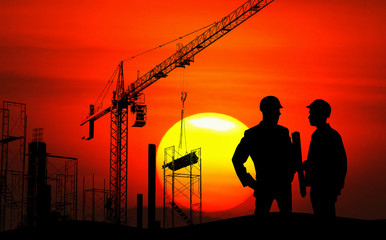 Engineer on site, they are working at building construction area.