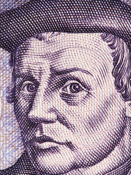 Thomas Muntzer on East German 5 mark (1975) banknote close up macro. Leading German radical Reformer during the Protestant Reformation. .