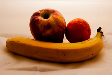 Fruit: apple, banana and mandarin