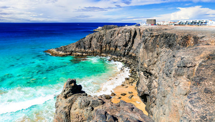 Fuerteventura - view of rocky beach and Toston tower in El Cotillo. Canary islands