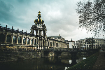 Fototapeta na wymiar Dresdner Zwinger in Dresden with people,dramatic sky. Cityscape in Dresden. Travel and tourism in Dresden concept