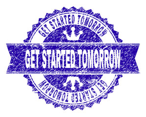 Obraz premium GET STARTED TOMORROW rosette stamp watermark with grunge effect. Designed with round rosette, ribbon and small crowns. Blue vector rubber watermark of GET STARTED TOMORROW label with retro style.