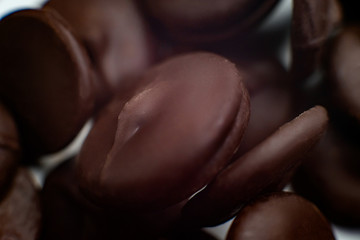 round pieces of chocolate for making chocolate glaze. macro.
