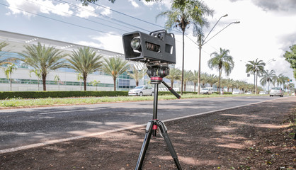Police radar installed near the road to control the speed limit.