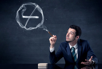 Businessman smoking cigarette and the smoke forms a no smoking sign.