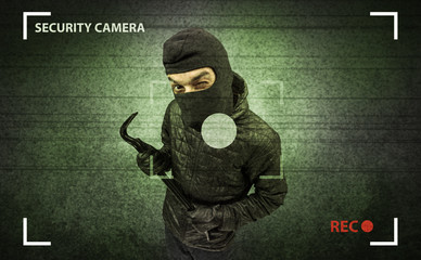 Caught burglar by house camera in action.