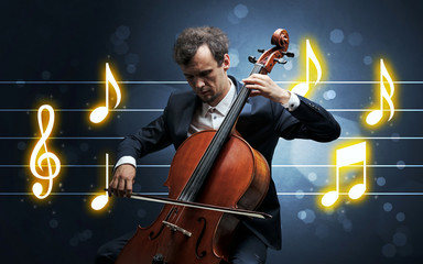Young handsome cellist playing with music sheet background