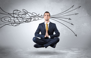 Businessman levitates in yoga position and systematize with thinking concept
