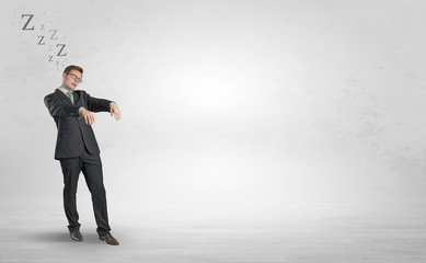 Obraz premium Tired businessman with sleeping sickness going somewhere 