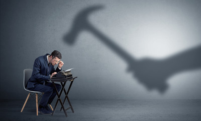 Shadow threatening hard worker man who is afraid

