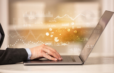 Business woman in homey environment using laptop with financial report concept
