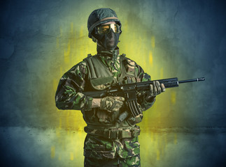 Hazard, menace soldier in a ruined crumbly building with arms on his hand
