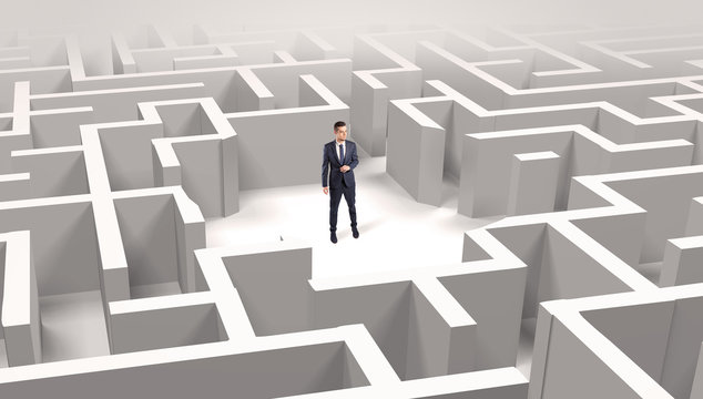 Young businessman standing in a middle of a 3D maze
