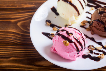 Ice cream with walnuts and chocolate topping
