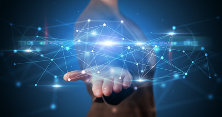 Handsome person holding hologram screen displaying modern cloud based web system technology
