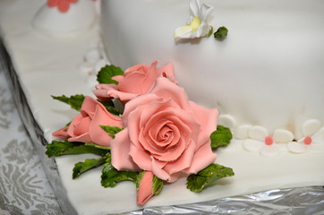 pink rose on the bride's cake