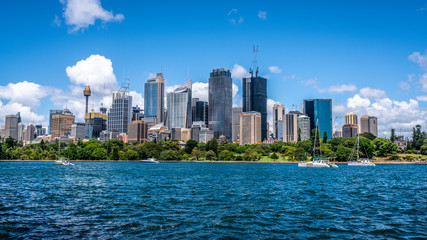 Naklejka premium Ocean and Sydney CBD skyline landscape panorama during a summer day in Sydney Australia