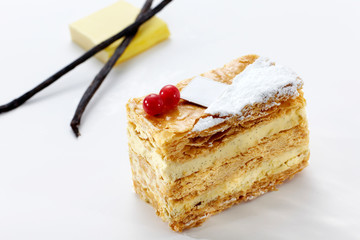 Delicious napoleon cake on white background