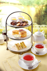 Delicious English afternoon tea set on a white background - obrazy, fototapety, plakaty