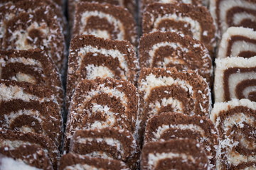 chocolate roll cake filled with coconut cream and cocos 