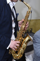 Naklejka premium Man plays the saxophone